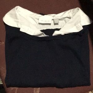 Navy blue girls long sleeve uniform shirt.